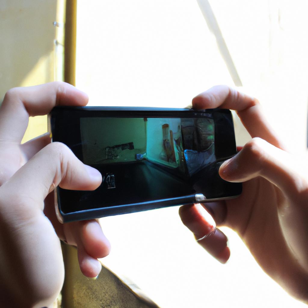 Person holding smartphone, playing game